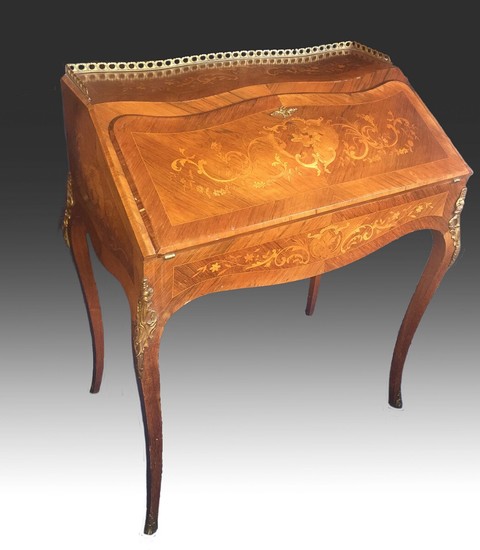 A late 19th century Rococo style bronze mounted rosewood bureau, richly inlaid with intarsia, front with writing leaf and drawers. H. 95. W. 74. D. 43 cm.