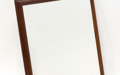 A late 20thC teak mirror with a moulded frame. 33" wide x 34" high. Please Note - we do not make