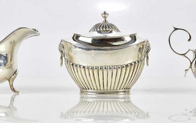 A late Victorian hallmarked silver tea caddy and cover with...