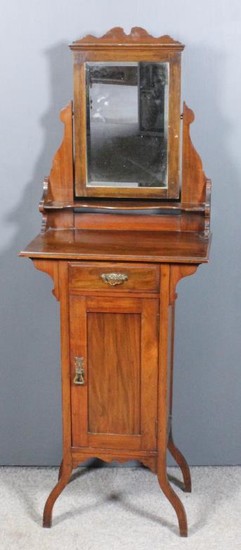 A late Victorian walnut shaving stand with rectangular mirror...