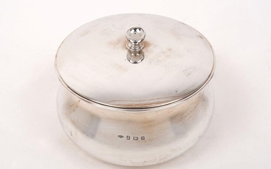 A lidded circular silver dish, Birmingham, c.1911, John Grinsell & Sons, of round waisted form with globular finial to pull-off lid, 8cm high, approx. weight 12.8oz