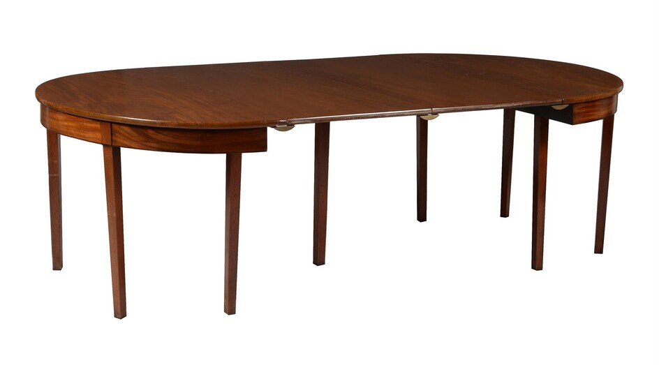 A mahogany dining table in George III style