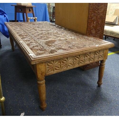 A mid-20th century Tanzanian carved hardwood Coffee Table, t...