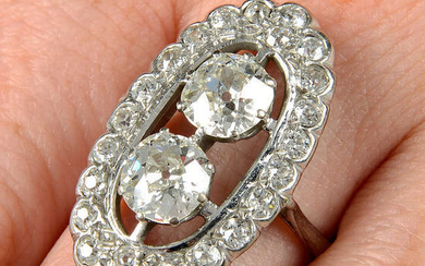 A mid 20th century old-cut diamond two-stone ring, with old-cut diamond shared surround.