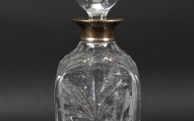 A mid century silver mounted glass decanter, the cut glass body decorated with floral sprays