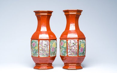 A pair of Chinese famille rose coral-red ground vases with birds among blossoming branches, Qianlong...