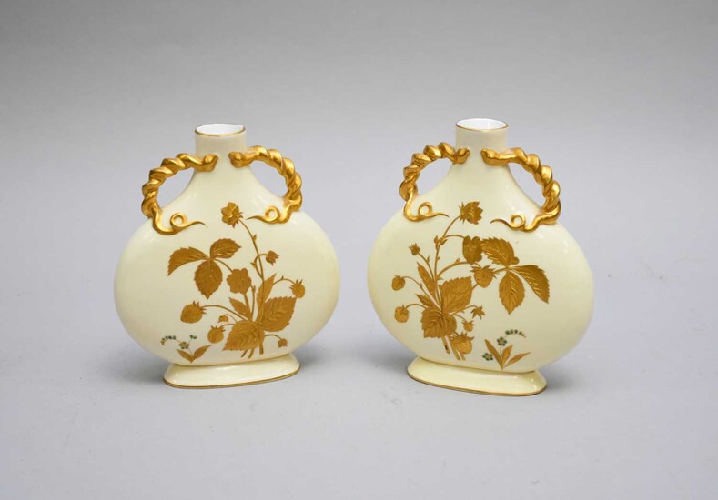 A pair of Davenport moonflasks decorated with a strawberry plant