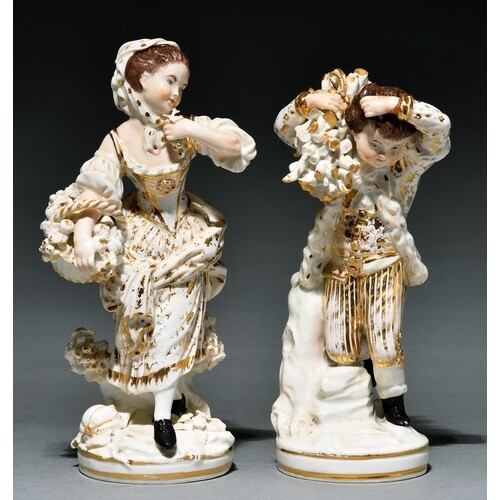 A pair of Derby figures of a boy and girl as Winter and Autu...
