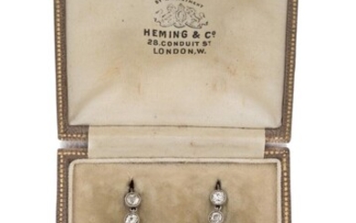 A pair of Edwardian, diamond and pearl set drop earrings, each in the form of a line of old brilliant-cut diamond articulated collets with single pearl drop, c.1905, approx. length 3cm Please note that the pearls in this lot have not been tested...