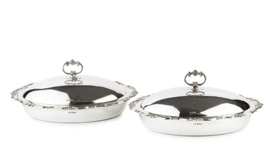 A pair of Edwardian silver oval entree dishes and covers,...