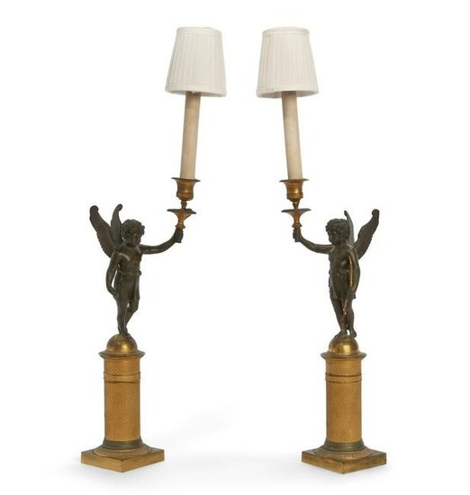 A pair of Empire bronze figural candlestick lamps