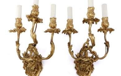 A pair of French late 19th centyr Rococo revival gilt bronze sconces...