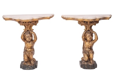 A pair of Italian marble topped, carved and giltwood console...