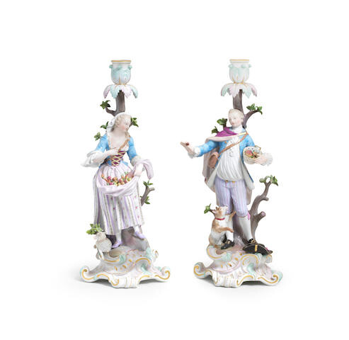 A pair of Meissen figural candlesticks together with a Meissen candlestick allegorical of Winter, late 19th century