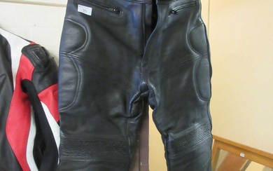 A pair of black leather motorcycle trousers by HunterCondition Report...