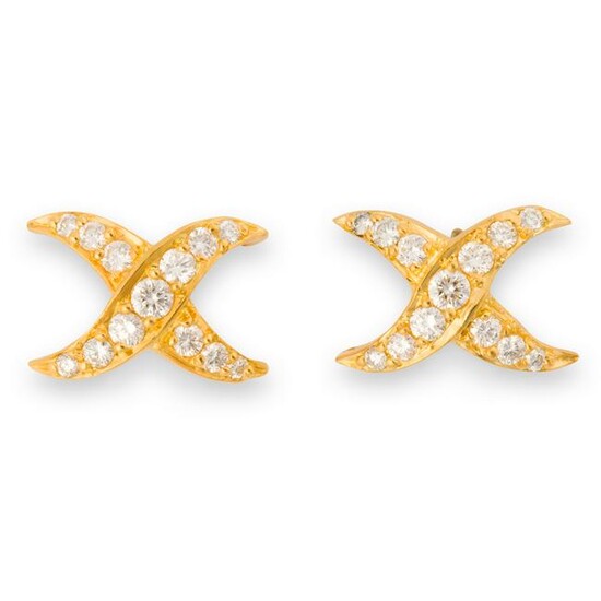 A pair of diamond and eighteen karat gold stud earrings
