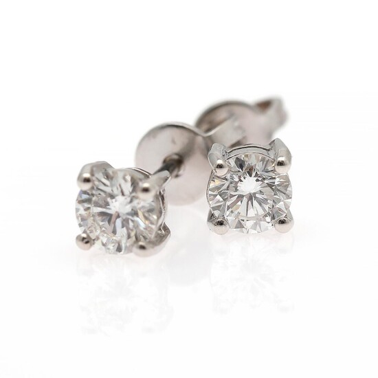 SOLD. A pair of diamond ear studs each set with a brilliant-cut diamond weighing a total of app. 0.73 ct., mounted in 18k rhodium plated gold. (2) – Bruun Rasmussen Auctioneers of Fine Art
