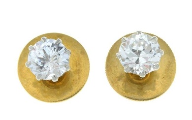 A pair of early 20th century 18ct gold and platinum white sapphire dress studs.