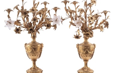 A pair of gilt metal and onyx mounted seven light candelabra...