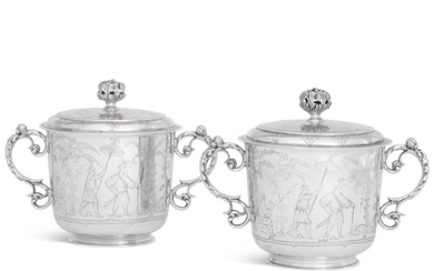 A pair of large silver cups and covers, Carrington &...
