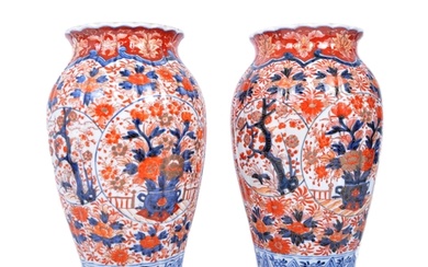 A pair of late nineteenth century Japanese Imari urns, featu...