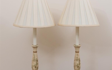 A pair of small lamps with cream shades and painted...