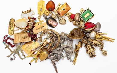 A quantity of 19th and early 20th century miniature articulated marionette and other charms, marionette charms include a rose-cut diamond set doll, a gold and painted enamel doll, a gold and enamel king puppet; other charms include, a gold and...