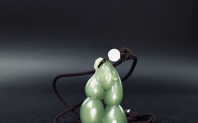 A rare and precious green Chinese carved hetian nephrite...