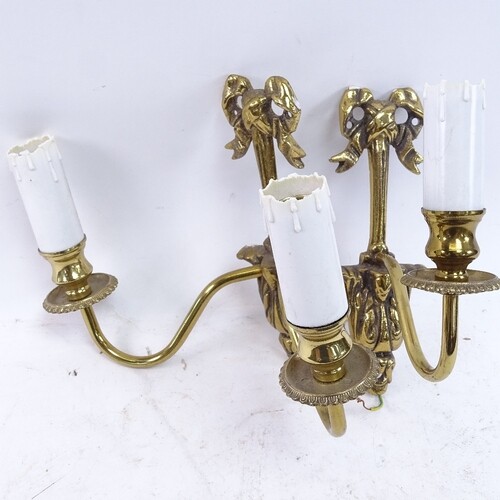 A set of cast-brass wall hanging light fittings