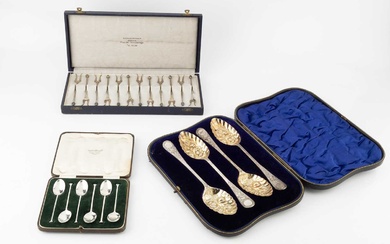 A set of four Edwardian silver berry spoons, by William...