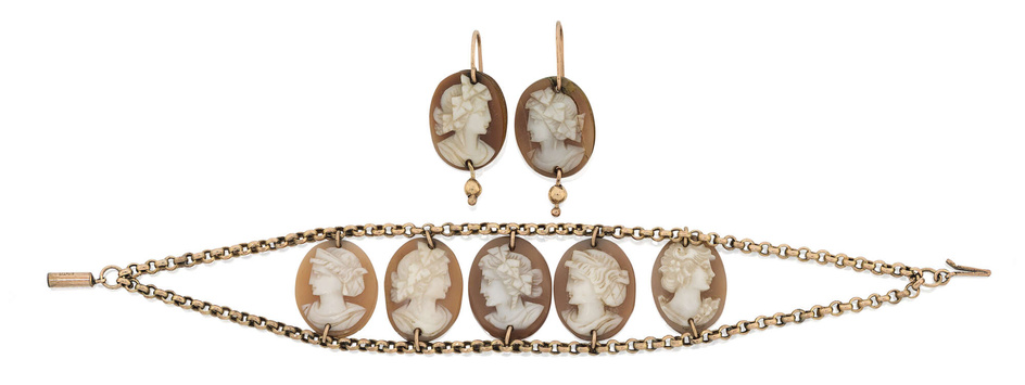 A shell cameo bracelet and matching earrings, the bracelet designed...