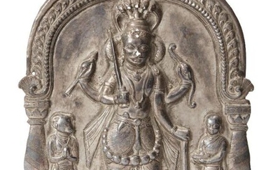 A silver repousse votive plaque with Shiva...