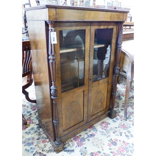 A small mid 19th century French rosewood two door cabinet (f...