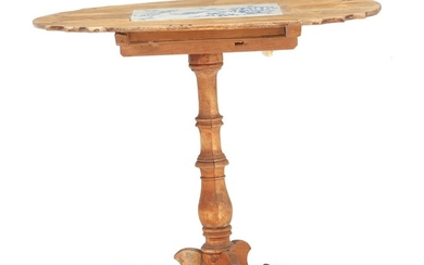 A small rural Swedish pinewood tilt-top table with a Dutch faience tile. Table mid 19th century, tile 18th century. H. 63 cm. W. 70 cm. D. 57 cm.