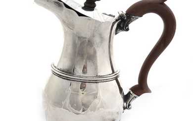 A very nice silver jug with wooden handle and...