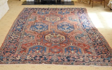 AN ANTIQUE MIDDLE EASTERN CARPET decorated with motifs