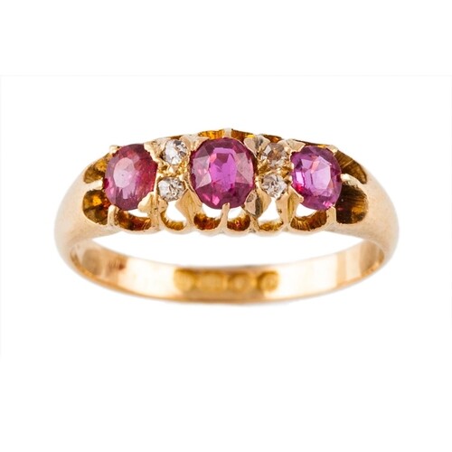 AN ANTIQUE RUBY AND DIAMOND RING, the oval rubies set betwee...