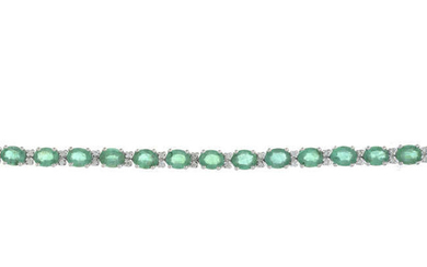 An 18ct gold emerald and brilliant-cut diamond line bracelet.