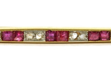 An Art Deco, gold, ruby and diamond bar brooch