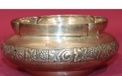 An Arts & Crafts silver round bulbous shaped fruit bowl with...