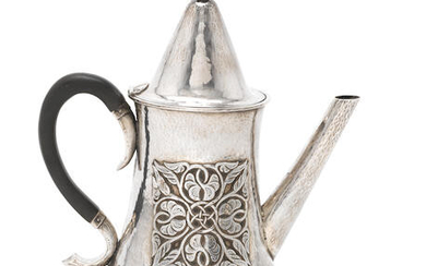 An Edwardian Arts and Crafts silver coffee pot