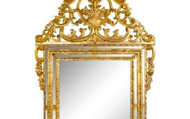 An Italian Baroque Style Giltwood Mirror Height 70 1/2