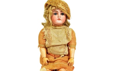 An antique pre-1919 bisque headed doll likely by Kestner. Im...