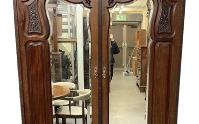 An early 20th century mahogany wardrobe, with pair of mirrored...
