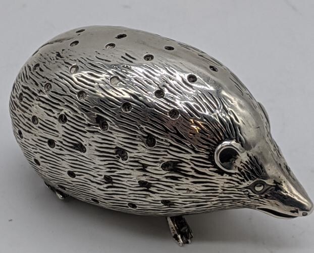 An early 20th century silver hedgehog pin cushion