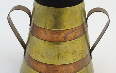 An early 20thC French twin handled brass souvenir vase