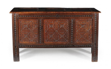 An oak triple panel chest