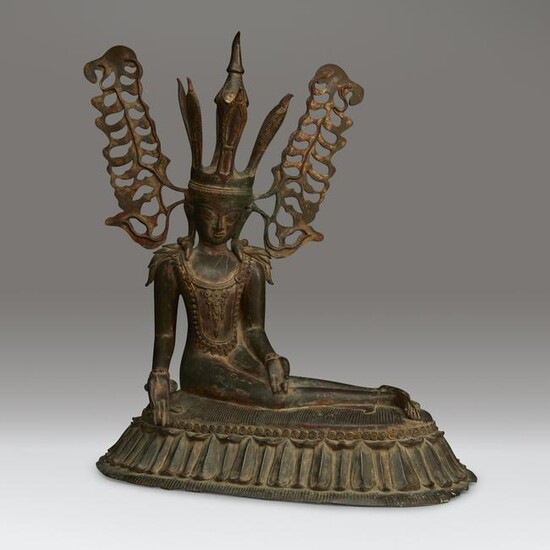 An unusual Burmese bronze figure of a seated