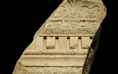 Ancient Roman Marble Architectural fragment of a Cornice with floral and faces of god Bes + mouses deco. H: 31 cm. Nice.