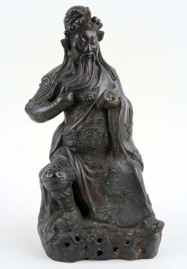 BRONZE STATUE DEPICTING A SEATED SCHOLAR READING